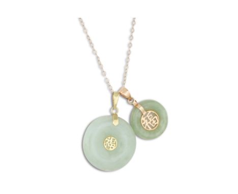 TWO JADE PENDANTS, of circular form, oriental design in 14ct gold, on a 9ct gold chain