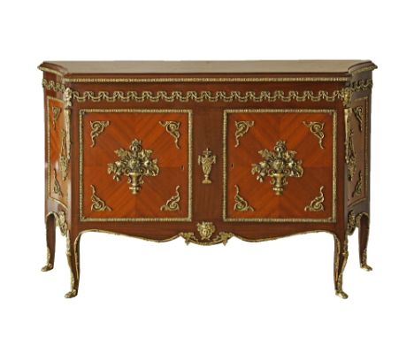 A large side cabinet / commode, decorated with brass mountings in the French Louis XV / Transition style, two doors revealing