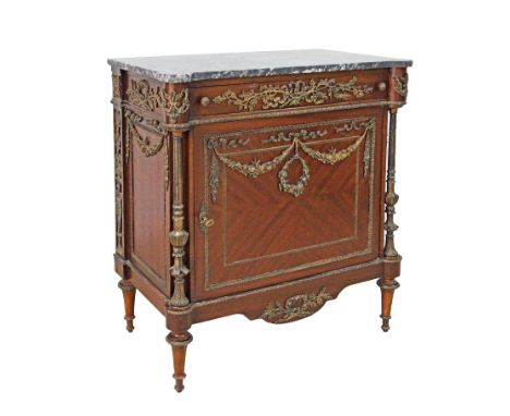 An Egyptian reproduction Louis XVI style commode, mahogany veneered and brass mounted, black marble top, one frieze drawer be