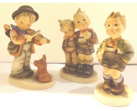 Three Goebel children figures