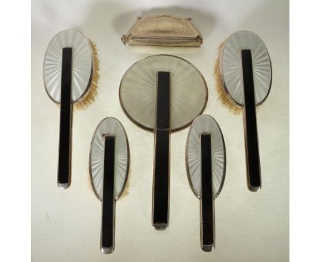 A STYLISHLY ART DECO FIVE PIECE SILVER AND GUILLOCHE CREAM AND BLACK ENAMELLED SUITE OF DRESSING TABLE ITEMS COMPRISING; A HA