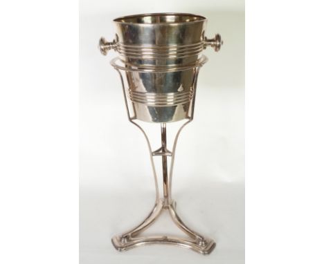 TWO SILVER PLATE ICE BUCKET STANDS, on tripod bases, 18" (45.6cm) high, WITH ASSOCIATED ICE BUCKETS, AND A SILVER PLATE ICE B