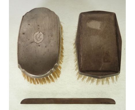 *TWO ENGINE TURNED SILVER BACKED CLOTHES BRUSHES, Birmingham 1930 and 1953, AND A SILVER COMB BACK