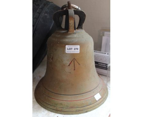 A large cast brass bell 29 cm high and 26 cm width. Stamped with broad arrow mark