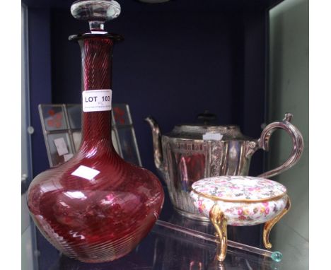 A shelf containing a mixed lot of silver plate tea pot, cranberry glass decanter etc (5)
