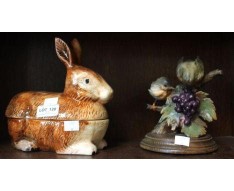 A ceramic lidded model of a hare with another of birds