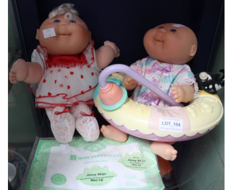 Two Cabbage Patch Kids dolls with birth certificate