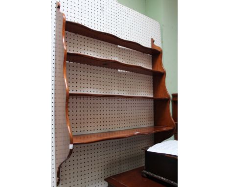 A mahogany four shelf waterfall style hanging wall shelf, 92cm wide x 110cm length of side ends   