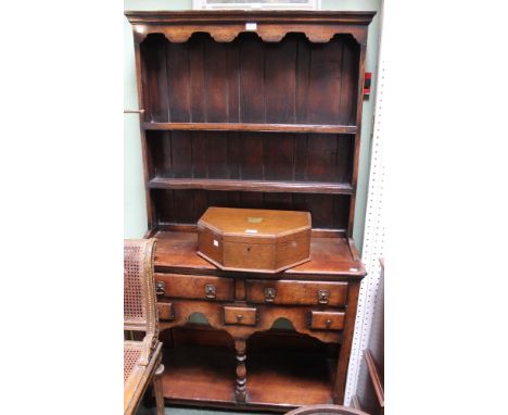 An oak dresser in the Georgian style with open under tier, three shelf plate rack of small proportions&nbsp;