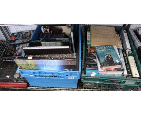 A shelf containing two plastic crates &amp; other loose hardback &amp; paperback books, mainly non fiction