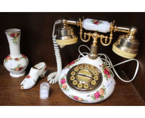 A shelf containing a Royal Albert "Old Country Roses" bone china telephone with three other items of RA (4)