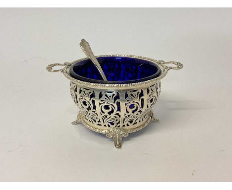 Mappin &amp; Webb pierced silver sugar basin with blue glass liner and sifter spoon, 15.5cm wide, Sheffield 1975

Silver weig