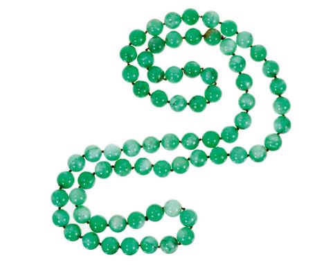 Chinese jade/green hardstone bead necklace with a long string of 15.5-16mm beads, approximately 120cm in length.