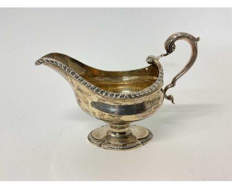 










Large George II style silver gravy boat, London 1932, inscribed 'hand wrought silver' to base, 14.5cm high x 19.5c