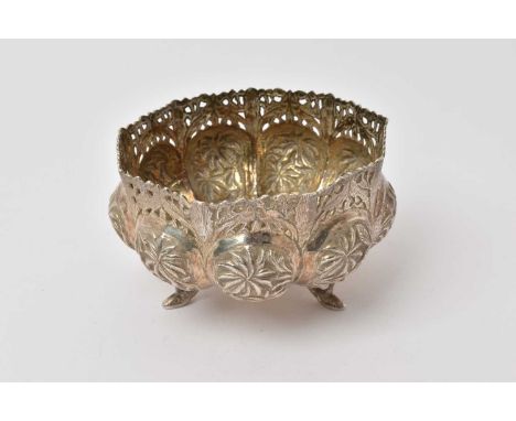 Late 19th/early 20th century Indian silver bowl of lobed form, with embossed animal and foliate decoration and pierced border