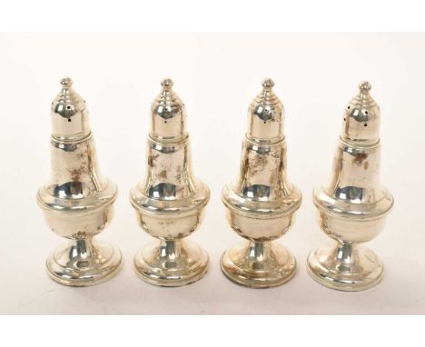 Set of four contemporary American Sterling silver casters of baluster form, with pierced slip in covers, weighted bases. Empi
