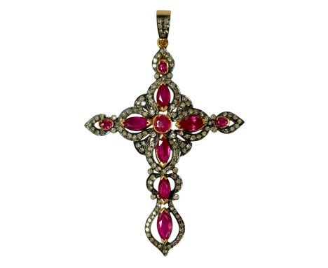 Victorian-style ruby and diamond cross pendant with mixed cut and marquise cut rubies surrounded by a border of diamonds in s