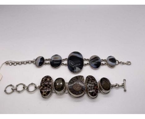 Two silver bracelets, one with polished ammonite fossil, smokey quartz and shells, 21cm, the other bracelet with oval banded 