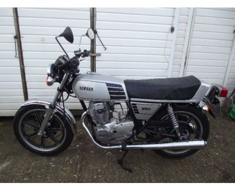 A 1978 Yamaha XS250, registration number AKJ 509T, silver. This XS250 has been restored by the vendor. The engine has been en