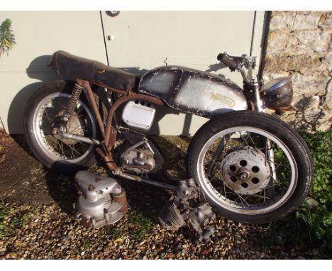 A Triton restoration project, with Triumph T110 engine, silver. This Triton project consists of a Tiger T110 dismantled engin