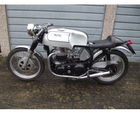 A 1960 Norton Dominator 99 café racer, registration number 715 UYL, silver. During the 1950s and 60s young enthusiasts were m