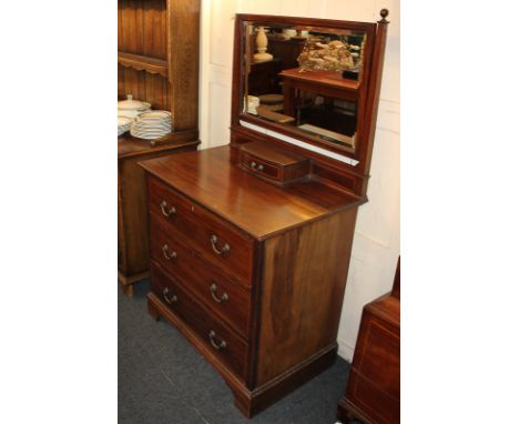 An Edwardian inlaid mahogany dressing table with rectangular mirror, central jewellery drawer, above three drawers, on bracke