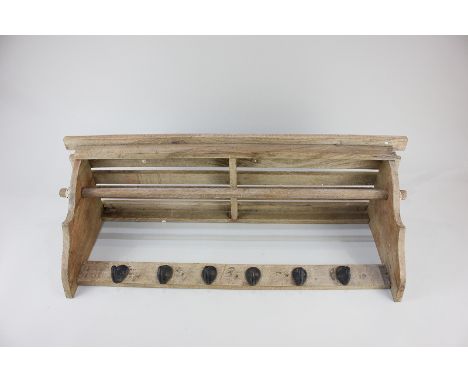 A children's coat rack with slatted wall shelf, hanging rail and six metal hooks below, 61cm