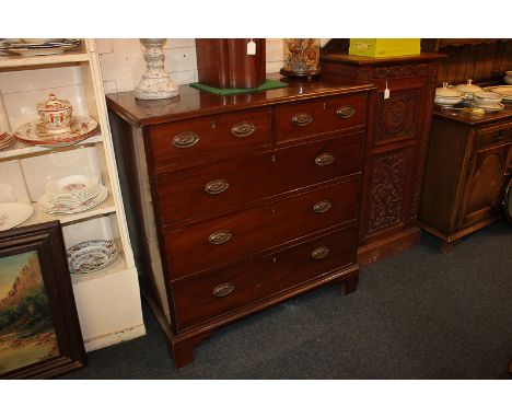 A Victorian cross-band mahogany chest of two short over three long drawers with acorn and oak leaf embossed brass drop handle