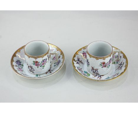 A pair of 19th century Samson porcelain coffee cans and saucers, with hand painted floral designs and gilt embellishment in t