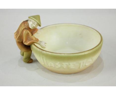 A Victorian Royal Worcester porcelain salt, mounted with a Chinese man with the motto 'Waste not, want not', 6.5cm high