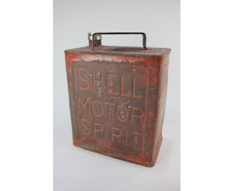 A red Shell oilcan marked Shell Motor Spirit, with Esso cap, 28cm by 25cm