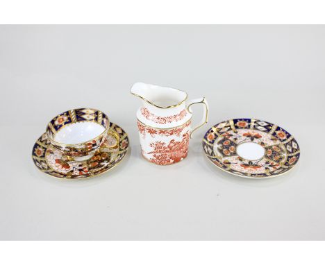 A pair of Davenport porcelain Imari pattern saucers with matching teacup, together with a Royal Crown Derby milk jug in the R