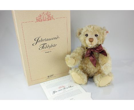 A Steiff blond mohair growler Year 2000 teddy bear, numbered 4420, with original certificate and box, 43cm tall