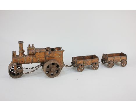 A painted metal toy steam roller and two carriages marked 'Wallworks Patent' (a/f)