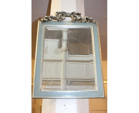 A silver painted rectangular wall mirror with pierced ribbon surmount, mirror plate 40cm by 29cm