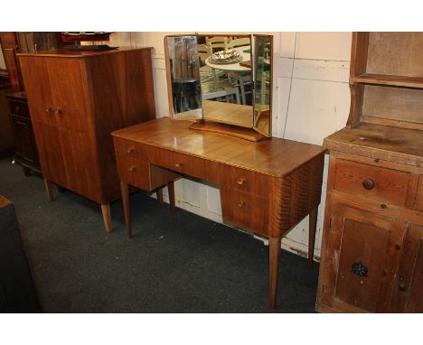 A Gordon Russell walnut dressing table with three-section mirror and five drawers, 122cm, together with a matching short ward