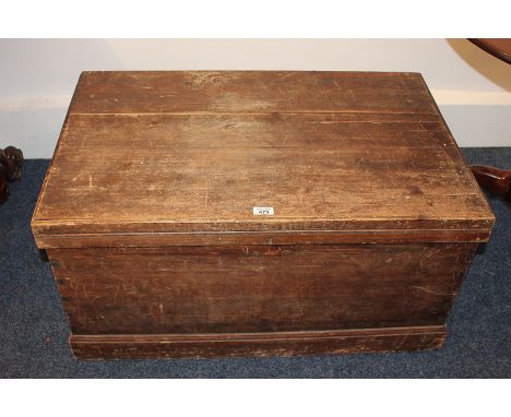 A stained pine trunk with metal carry handles, 87cm