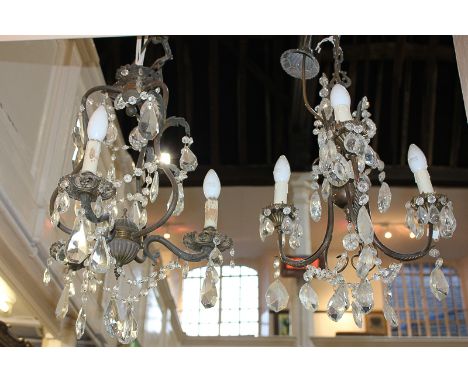 A brass and cut glass three-branch chandelier ceiling light fitting, 46cm, together with a similar light fitting, 44cm, (a/f)