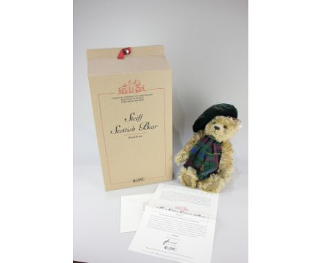 A Steiff Scottish bear in blond mohair, wearing Scottish Parliament tartan 1999, limited edition 2624/3000, with original cer