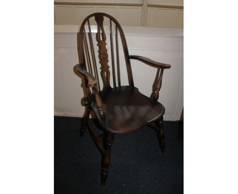 An Ercol style Windsor chair with hoop back, on turned legs