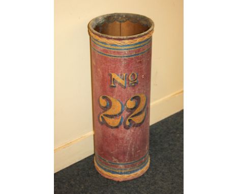 A painted cylindrical stick stand with hessian covering, decorated with 'No 22' in yellow on red ground, 57cm high