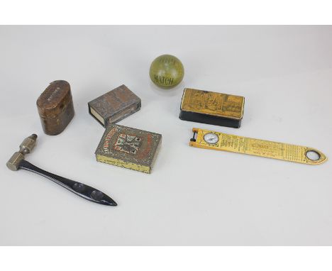 A papier mache snuff box decorated with a rural scene, a match metal miniature football, a French ruler with inset compass an