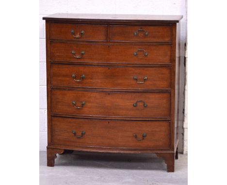 An Edwardian bow-front chest of drawers, two short over four long graduated drawers, on bracket feet, width 106cm.