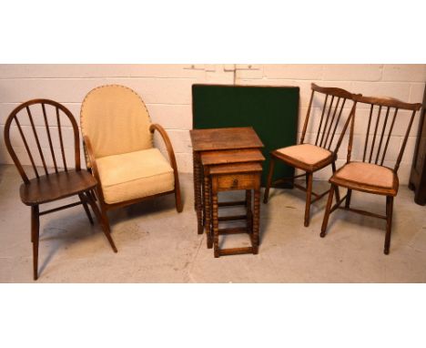 A 1930s upholstered armchair, a nest of oak tables, smallest having central drawer, all on turned legs, two mahogany bedroom 