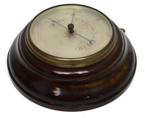 A circular mahogany-cased barometer with silvered dial, diameter 29cm.