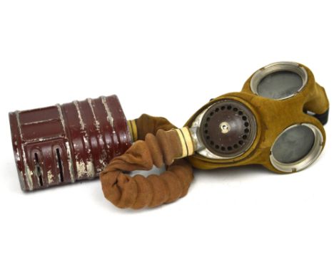 A WWII standard-issue canvas and rubber-faced gas mask, Model G20/112/39, with canister, hose and elasticated straps.