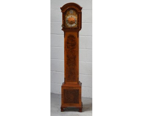 A reproduction inlaid grandmother clock, gilded and silvered dial set with Roman numerals, on stepped bracket supports, heigh
