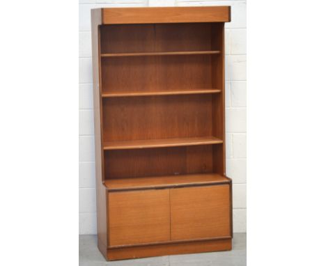 A retro G-Plan style three-shelf bookshelf with two lower doors, 173 x 92cm.