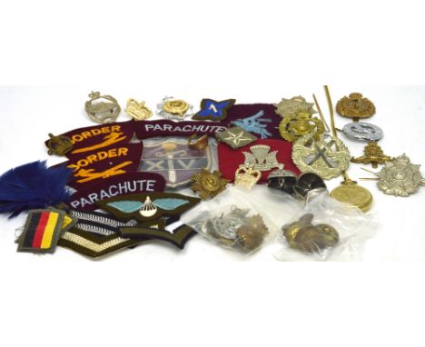 A collection of British and Allied 20th century military badges, buttons and decoration to include a WWII US Army Infantry ca