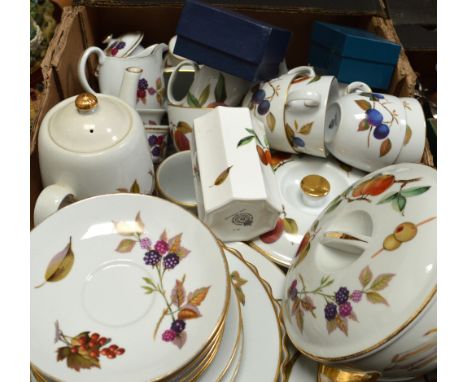 A quantity of Royal Worcester 'Evesham' decorated dinnerware to include two tureens, a quiche dish, coffee pot, plates etc.